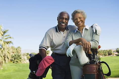 Older African American Couple Golfing