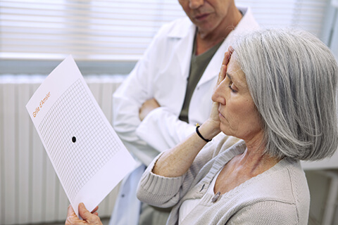 Older woman receiving an eye exam