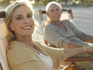 Mature couple in beach chairs