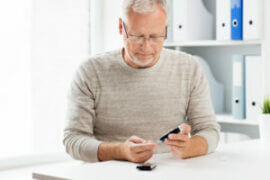 Man testing blood sugar