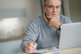 older man at laptop