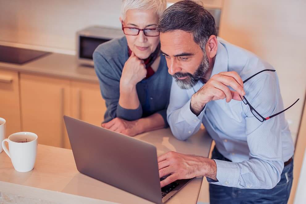 Couple looking at laptop